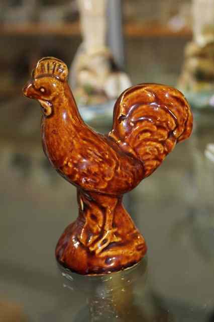 Appraisal: A COUNTRY POTTERY MODEL OF A COCKEREL late th Century