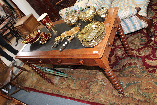 Appraisal: A VICTORIAN WALNUT WRITING TABLE with leatherette inset top over