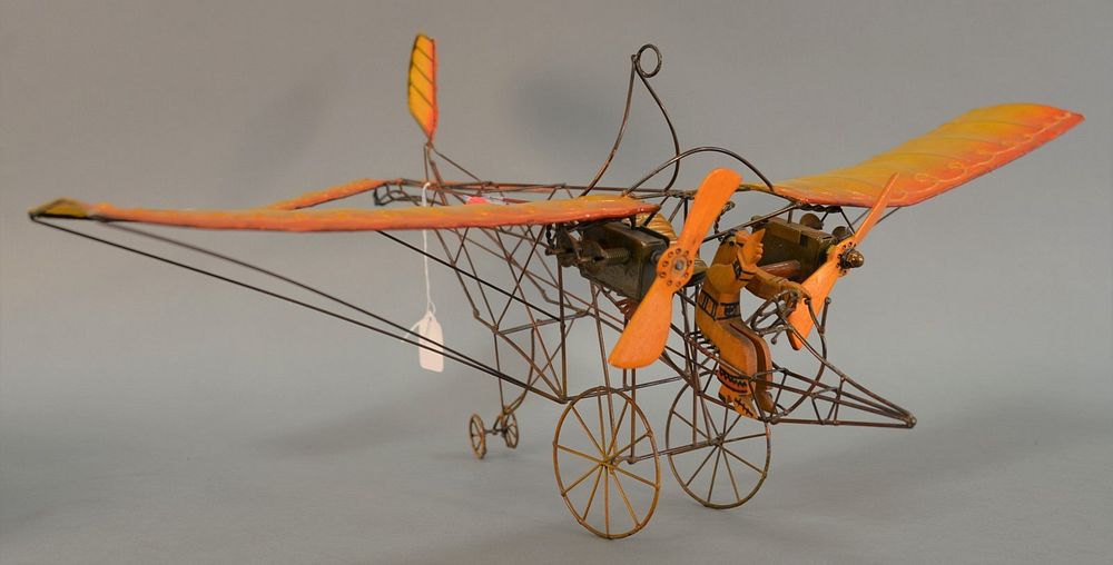 Appraisal: Model airplane wire frame orange cardboard wings wooden pilot figurine