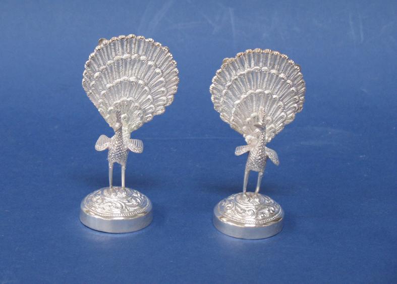 Appraisal: A PAIR OF WHITE METAL MENU CARD HOLDERS modelled in