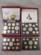 Appraisal: Four proof sets of British coins each in leather presentation