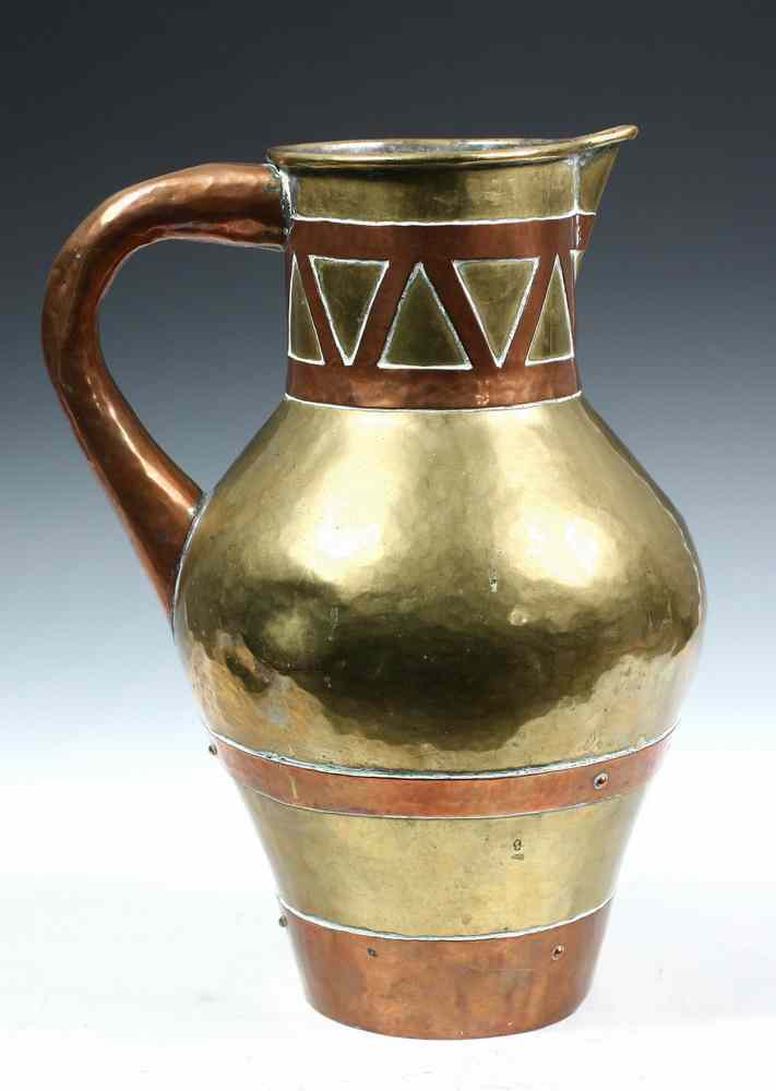 Appraisal: RUSSIAN BRASS AND COPPER PITCHER - Russian Hand-Hammered Brass Pitcher