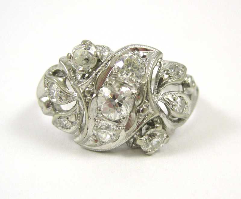 Appraisal: DIAMOND AND FOURTEEN KARAT WHITE GOLD RING with appraisal The