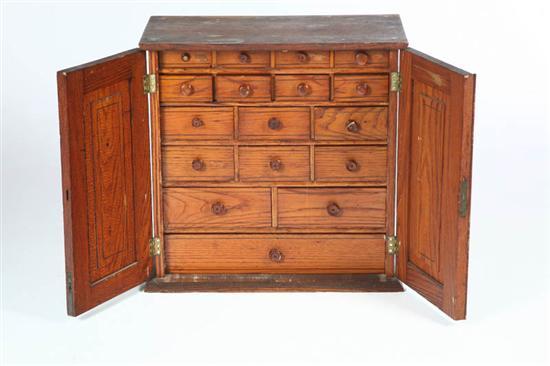 Appraisal: APOTHECARY CABINET American late th century chestnut Two paneled doors