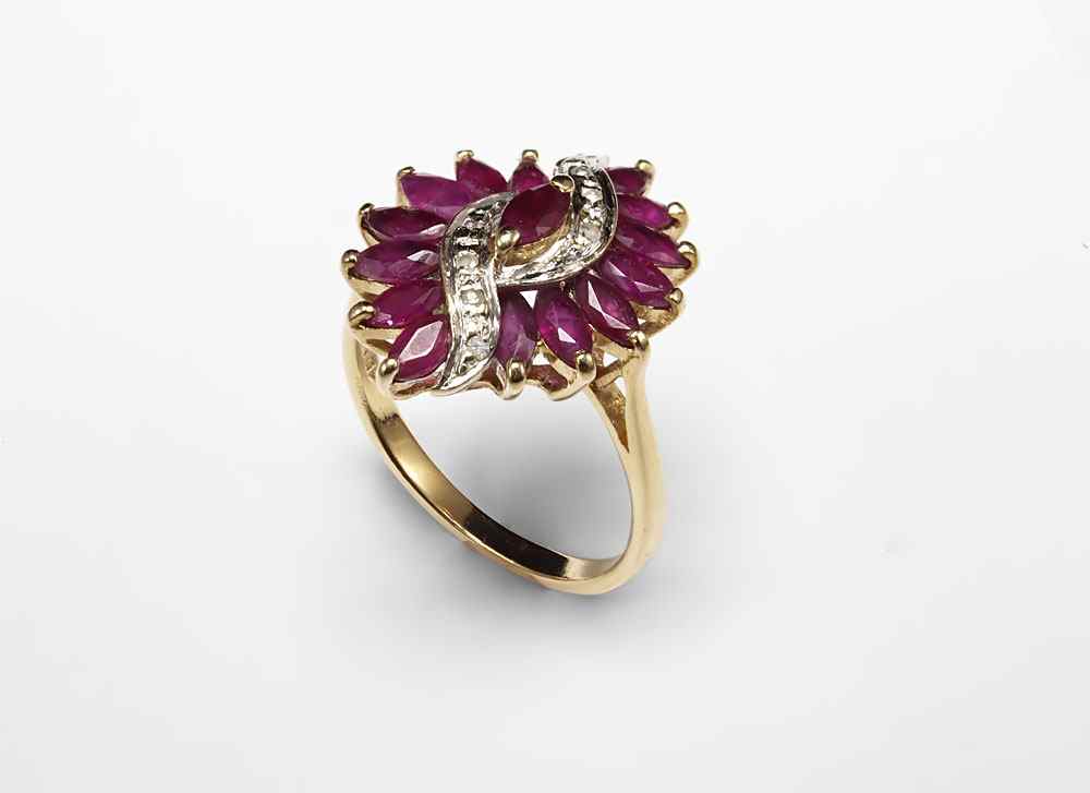 Appraisal: RUBY AND DIAMOND RING K yellow gold ring contains round