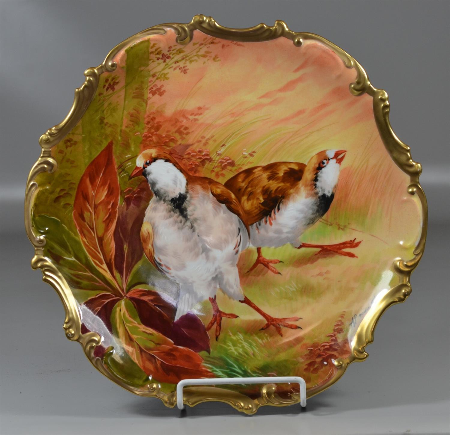 Appraisal: Coronet Limoges hand painted porcelain charger with quail Rococo gilt