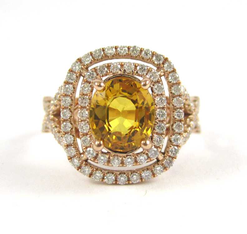 Appraisal: YELLOW SAPPHIRE AND FOURTEEN KARAT ROSE GOLD RING with round-cut