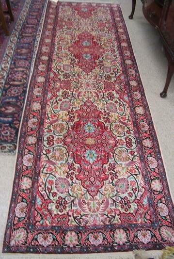 Appraisal: HAND KNOTTED ORIENTAL RUNNER Indo-Persian faux silk overall floral decoration