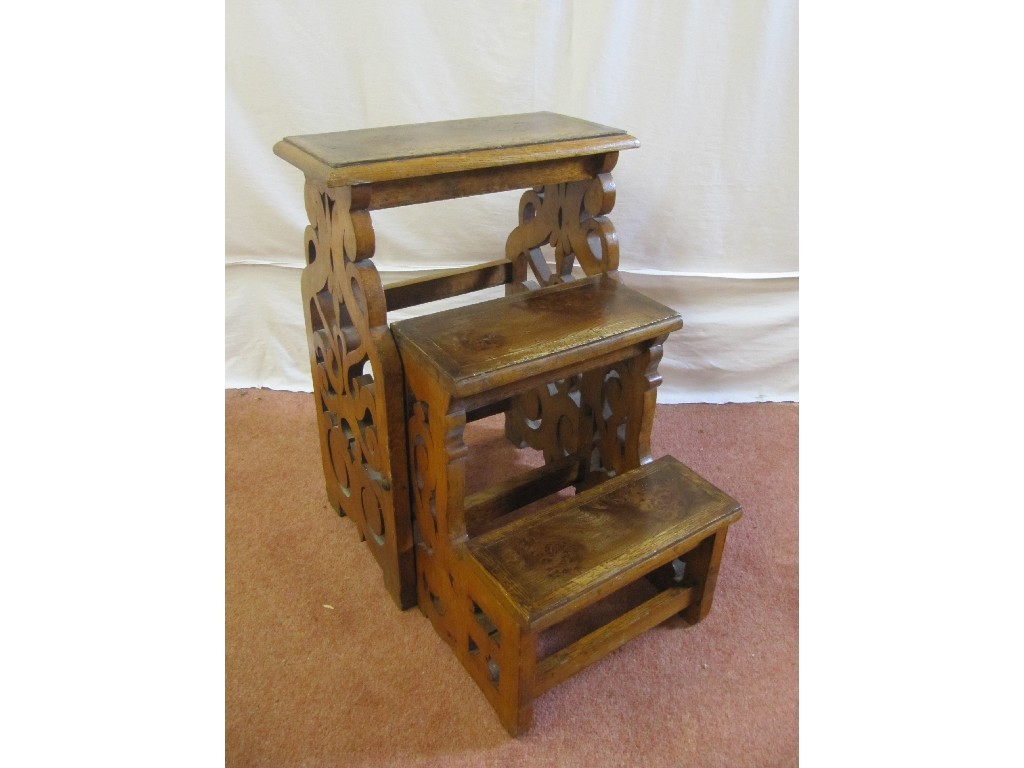 Appraisal: A set of oak and maple metamorphic library steps decorated