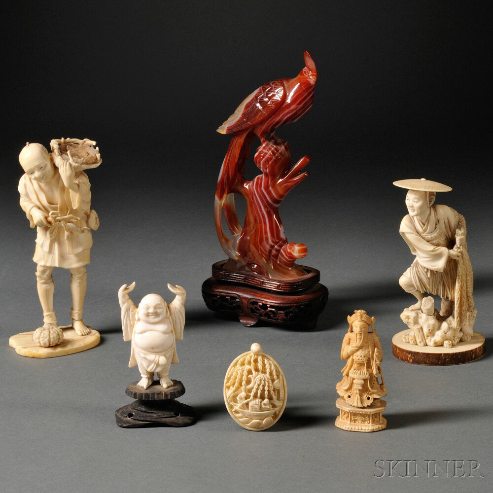 Appraisal: Six Small Carvings Asia a red hardstone bird perched on