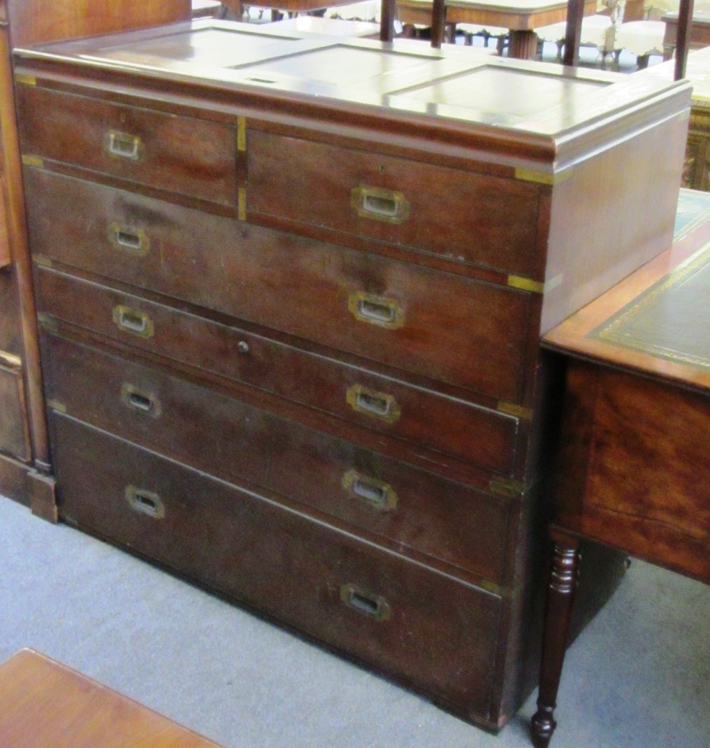 Appraisal: A th century teak campaign chest the panelled lift top