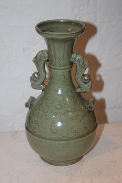 Appraisal: A CHINESE MING CELADON BOTTLE VASE with incised decoration and