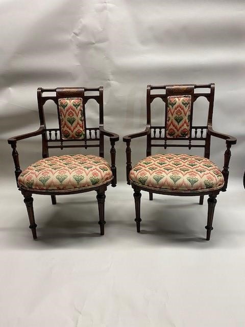 Appraisal: Pair of French walnut open arm chairs with inlayed splats