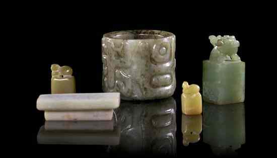 Appraisal: A Jade Archer's Ring and Three Seals the ring of