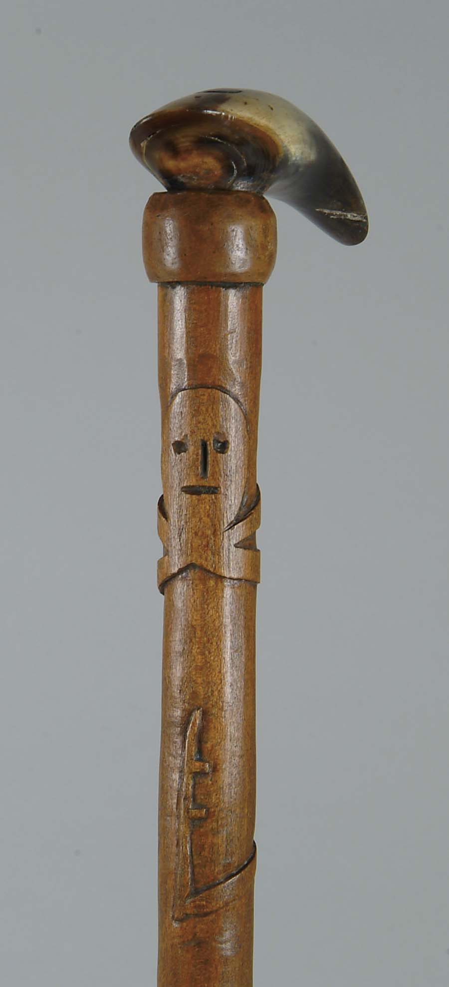 Appraisal: CANE CARVED WOOD AND HORN CANE Horn handle attached to