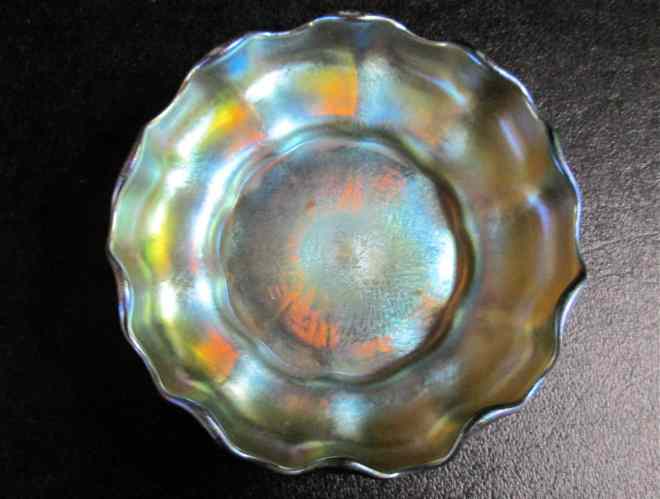 Appraisal: TIFFANY IRIDESCENT ART GLASS BOWL gold with silver-blue highlights ruffled