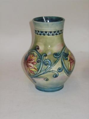 Appraisal: A WALTER MOORCROFT POTTERY VASE of baluster form tube lined