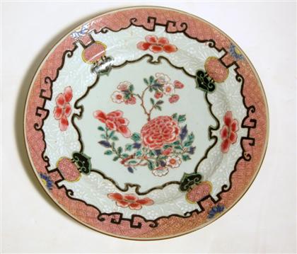 Appraisal: Large Chinese ruby ground famille rose porcelain chargerqianlong period