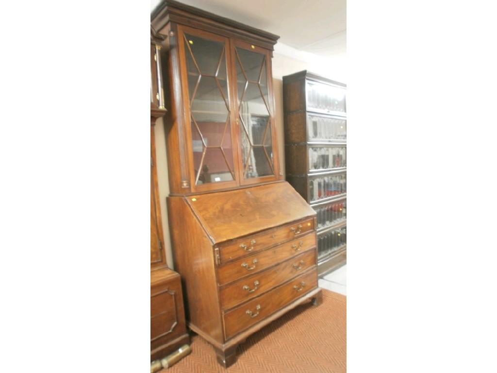 Appraisal: A George III flamed mahogany bureau with period matched bookcase