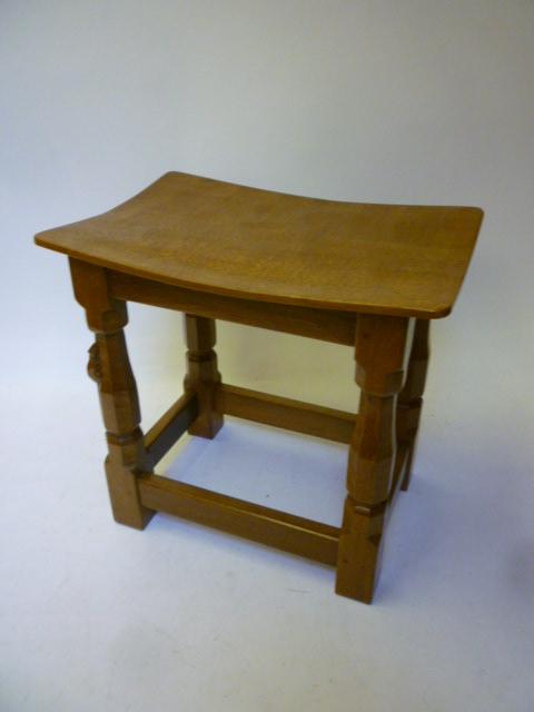 Appraisal: AN ADZED OAK STOOL by Robert Mouseman Thompson the dished