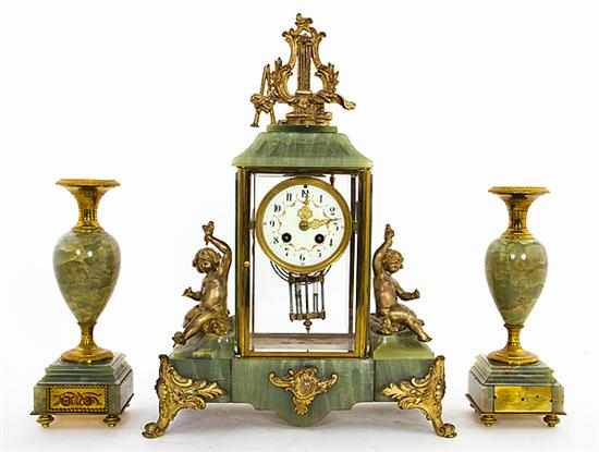 Appraisal: French onyx and ormolu clock garniture late th century gilded