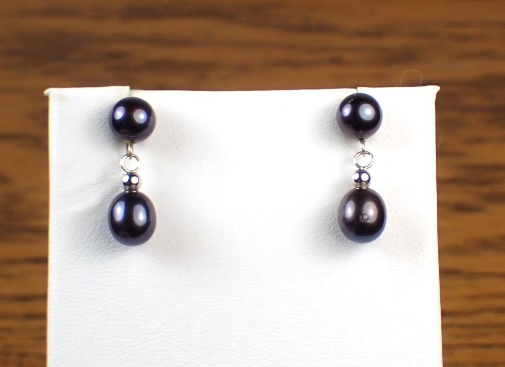 Appraisal: PAIR OF BLACK PEARL AND FOURTEEN KARAT GOLD EARRINGS Each