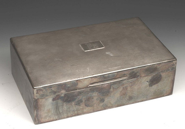 Appraisal: A SILVER CIGARETTE BOX with engine turned decoration crested London