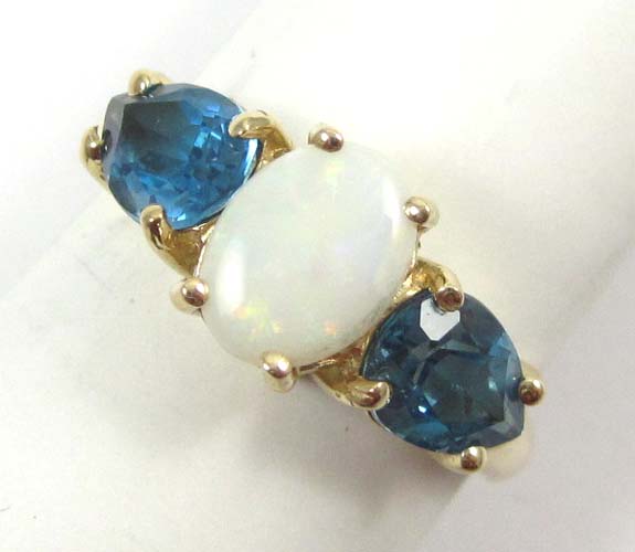 Appraisal: OPAL BLUE TOPAZ AND FOURTEEN KARAT GOLD RING two pear-cut