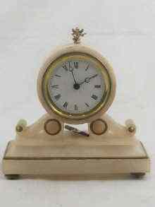 Appraisal: An alabaster cased mantel clock with French pendulum movement approx