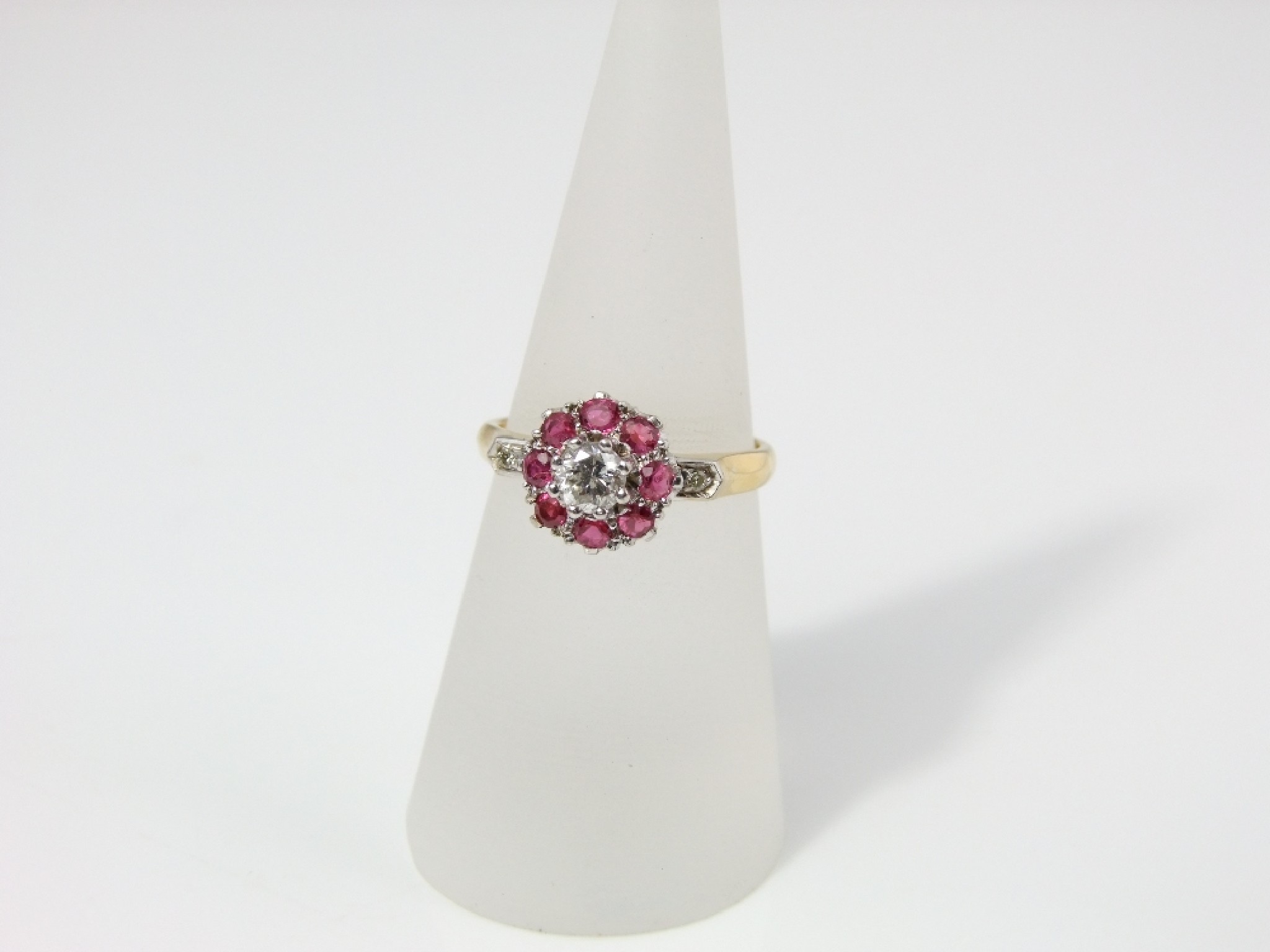 Appraisal: An ct gold diamond and ruby ring the central diamond