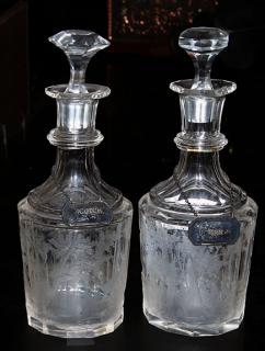 Appraisal: A pair of etched glass bourbon and scotch decanters late