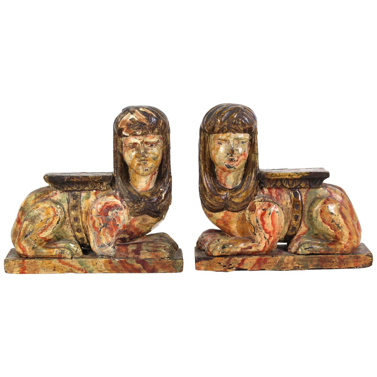 Appraisal: EGYPTIAN REVIVAL CARVED WOOD SPHINXES Continental pair of Egyptian Revival