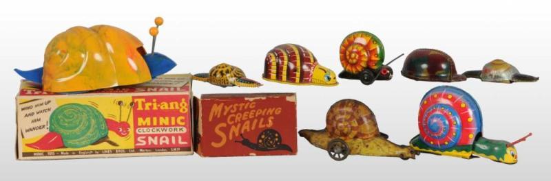 Appraisal: Lot of Snail Wind-Up Friction Toys Description Japanese German American