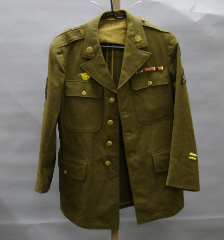 Appraisal: US WWII -pocket jacket with all cloth and brass insignia