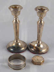 Appraisal: Silver A pair of candlesticks ht cm Birmingham a pill