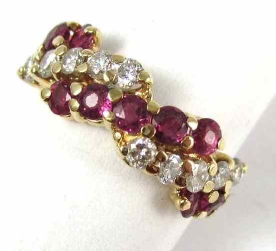 Appraisal: RUBY DIAMOND AND FOURTEEN KARAT GOLD RING set with eleven