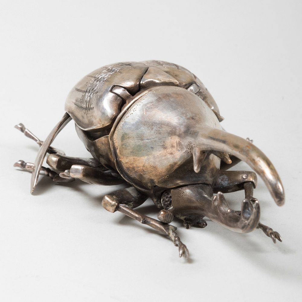 Appraisal: Silvered Metal Figure of a Horned Beetle With articulated wings