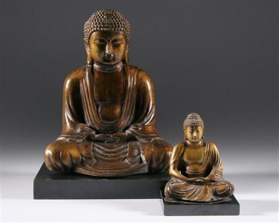 Appraisal: TWO JAPANESE FIGURES OF BUDDHA His face with serene expression