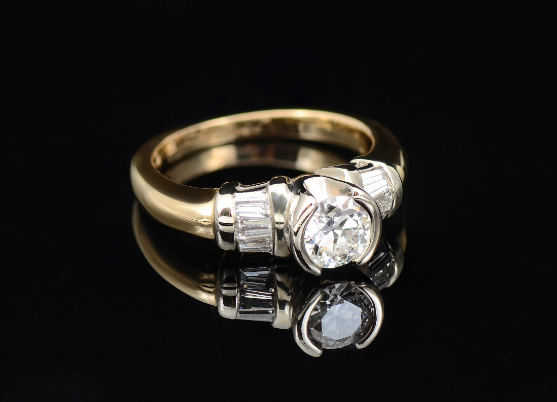 Appraisal: DIAMOND ENGAGEMENT RING A contemporary K yellow gold ring centering