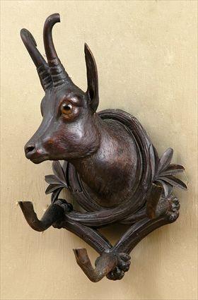 Appraisal: GERMAN CARVED WALNUT GOAT-HEAD WALL RACK The head turned to