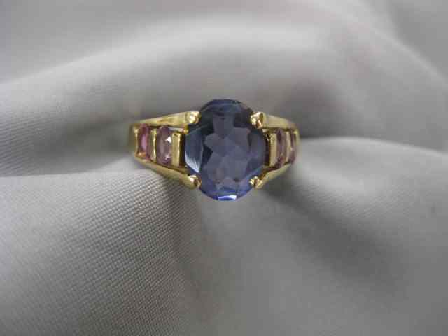 Appraisal: Tanzanite Pink Sapphire Ring carat rich oval tanzanite with two