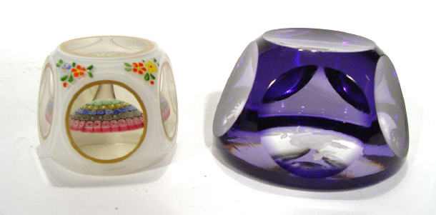 Appraisal: Faceted purple glass paperweight with floral decoration and an opaline