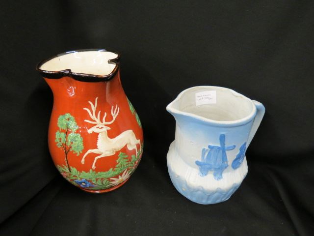 Appraisal: Pottery Pitchers blue and white stoneware with windmill and European