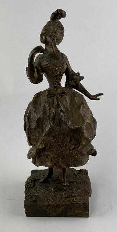 Appraisal: Small bronze figural woman dressed for the ball She had