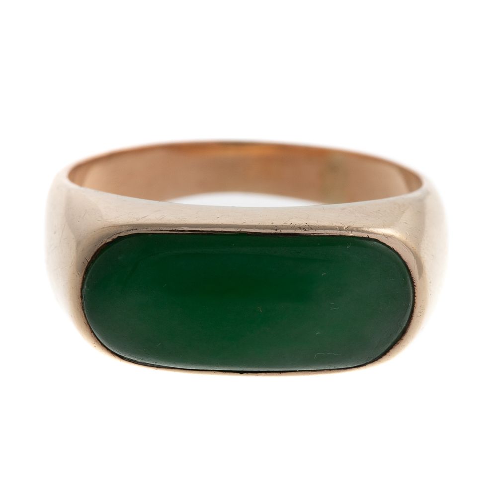 Appraisal: A Bezel-Set Jade Ring in High Polish K K yellow