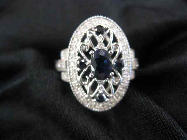 Appraisal: Sapphire Diamond Ring five deep bluegems totaling carat surrounded by