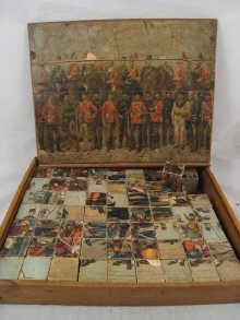 Appraisal: A Victorian wood brick puzzle with separate puzzles of the