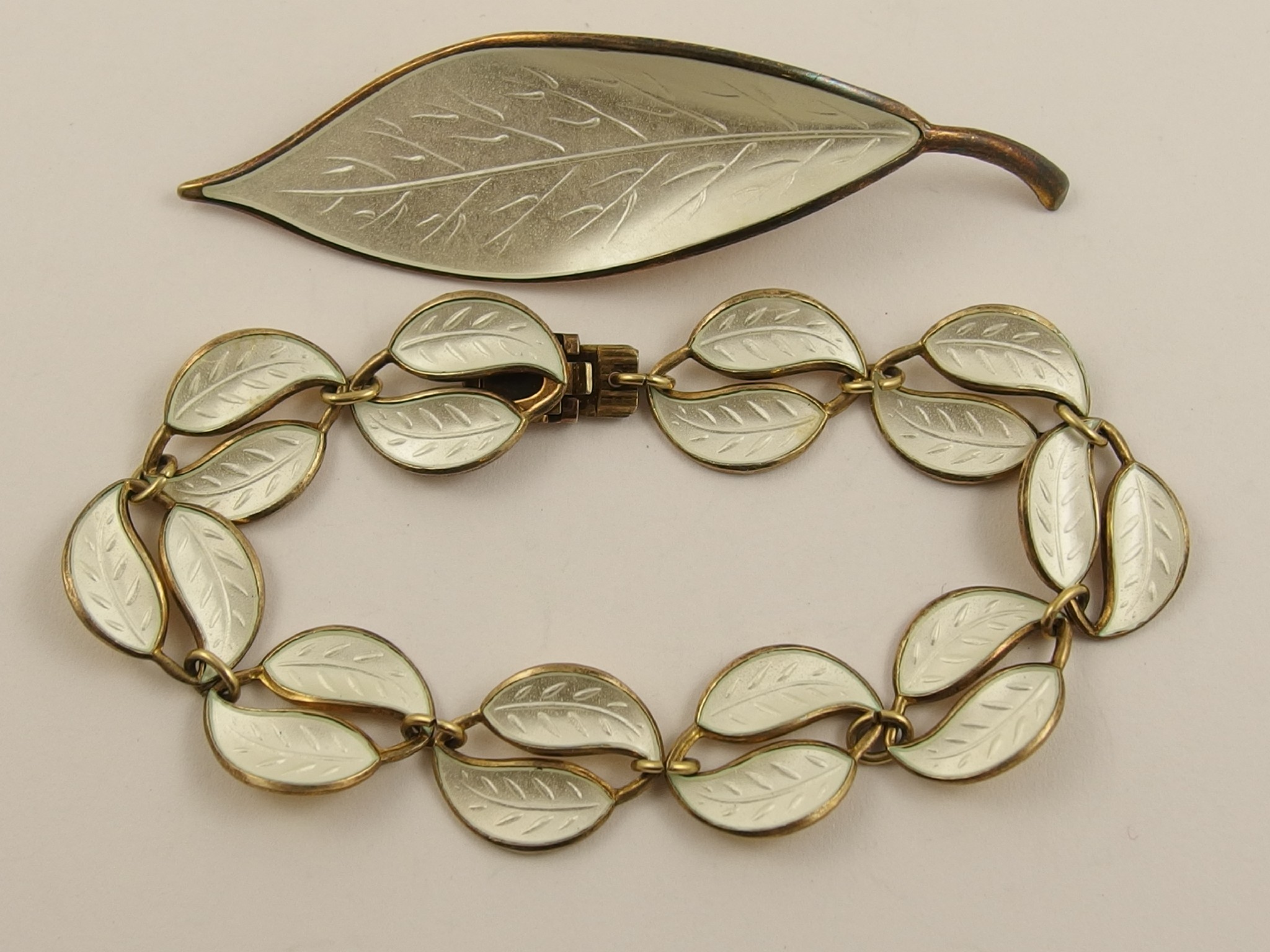 Appraisal: A David Andersen gilded silver leaf motif brooch and bracelet