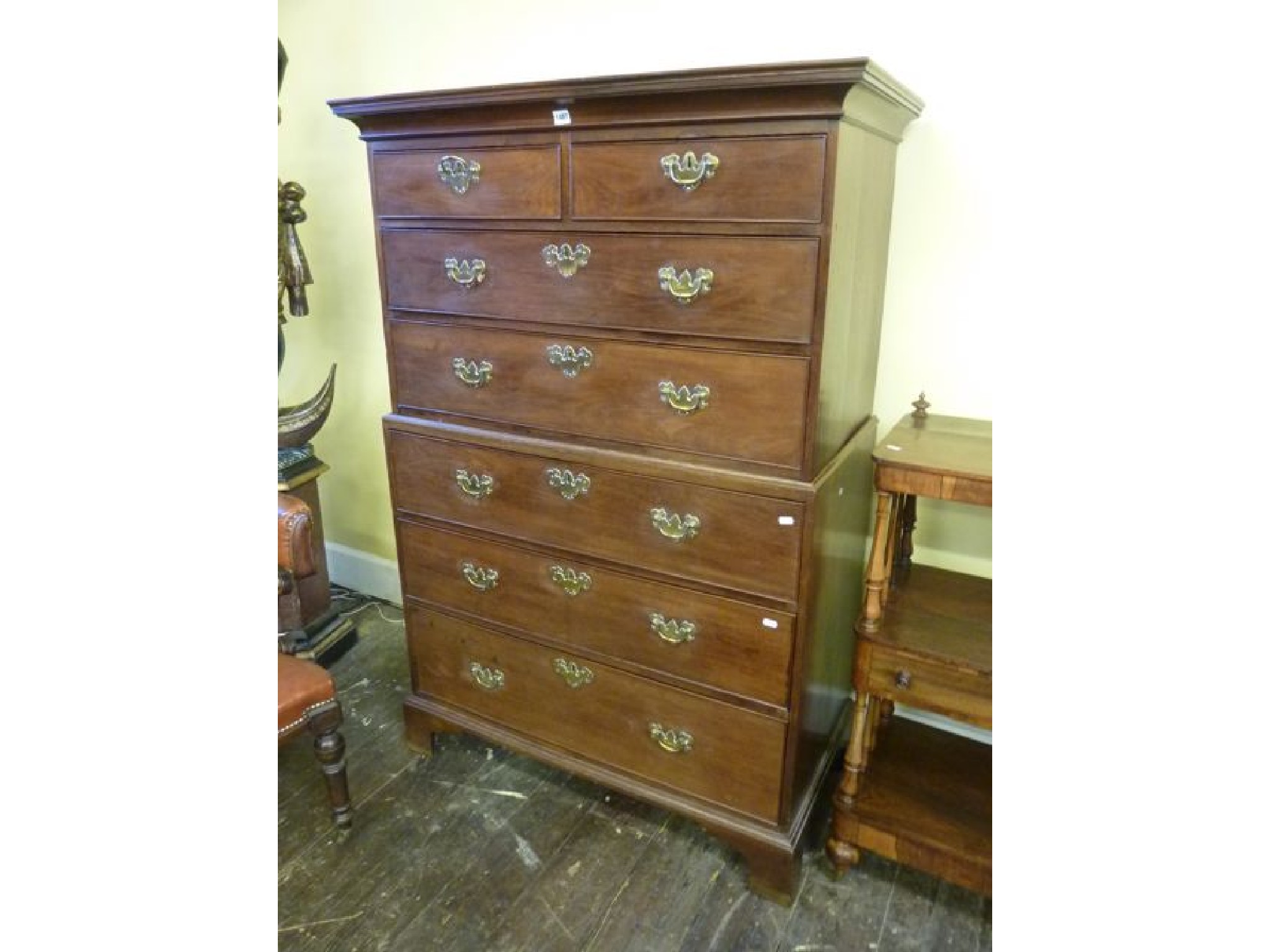 Appraisal: A small Georgian mahogany chest-on-chest enclosed by five long and