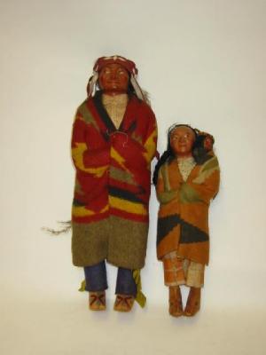 Appraisal: A Skookum Red Indian family comprising chief with composition head